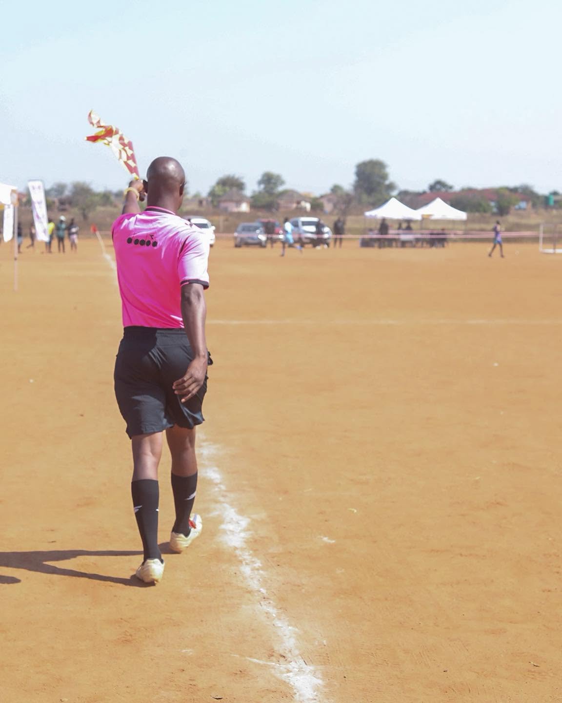 A player walks across the field during the tournament