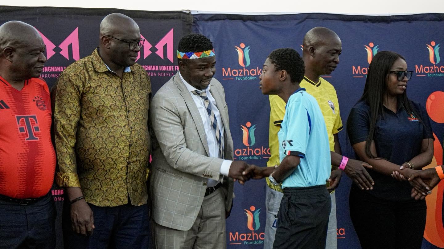 A football award is presented at the event