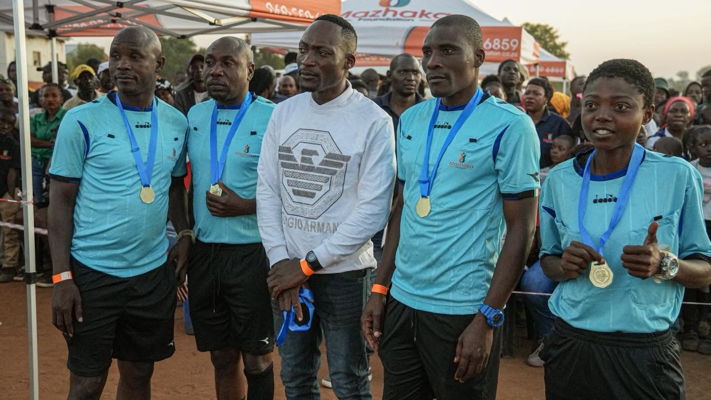 Officials gather for a tournament photo