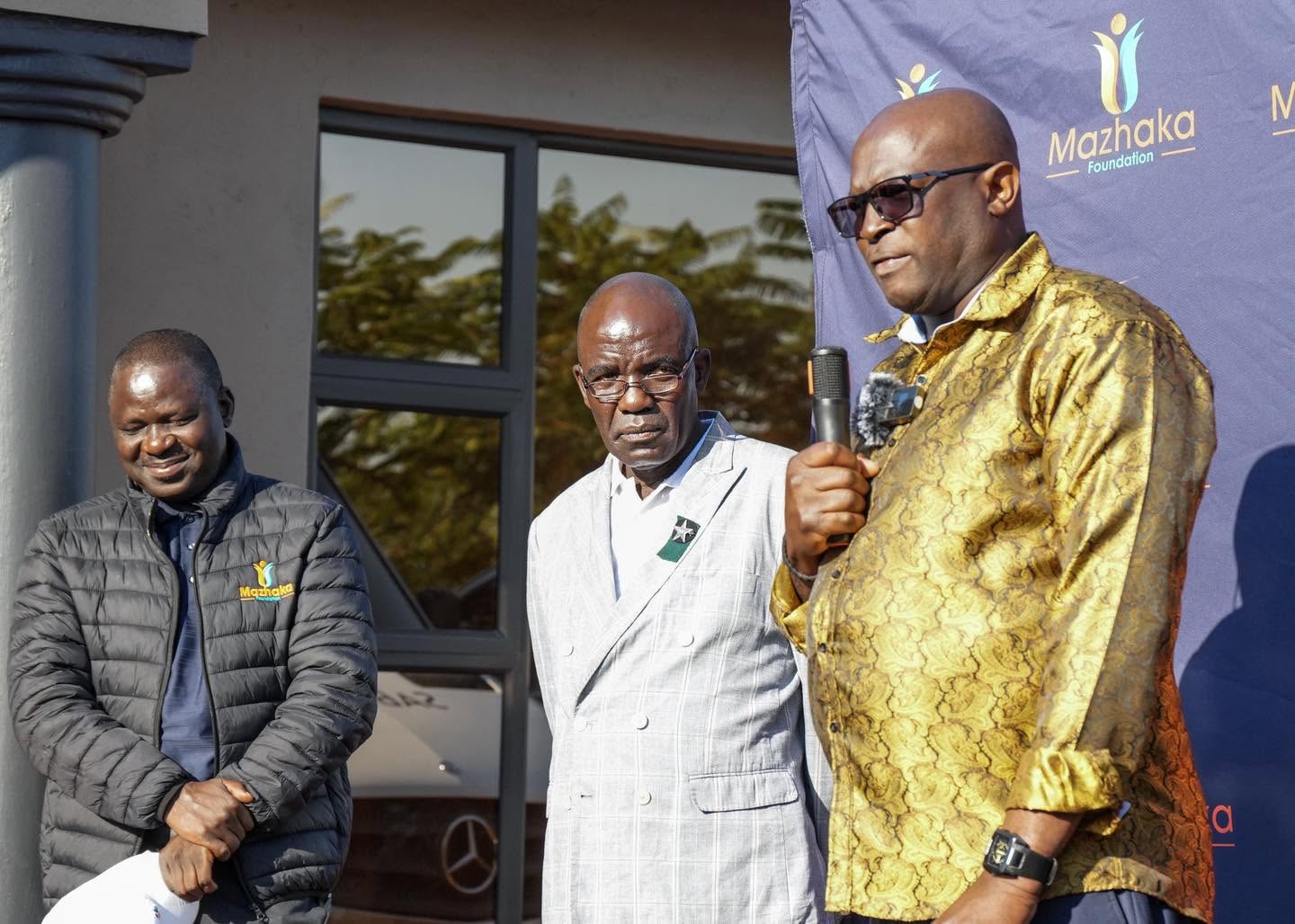 A speaker addresses the tournament gathering