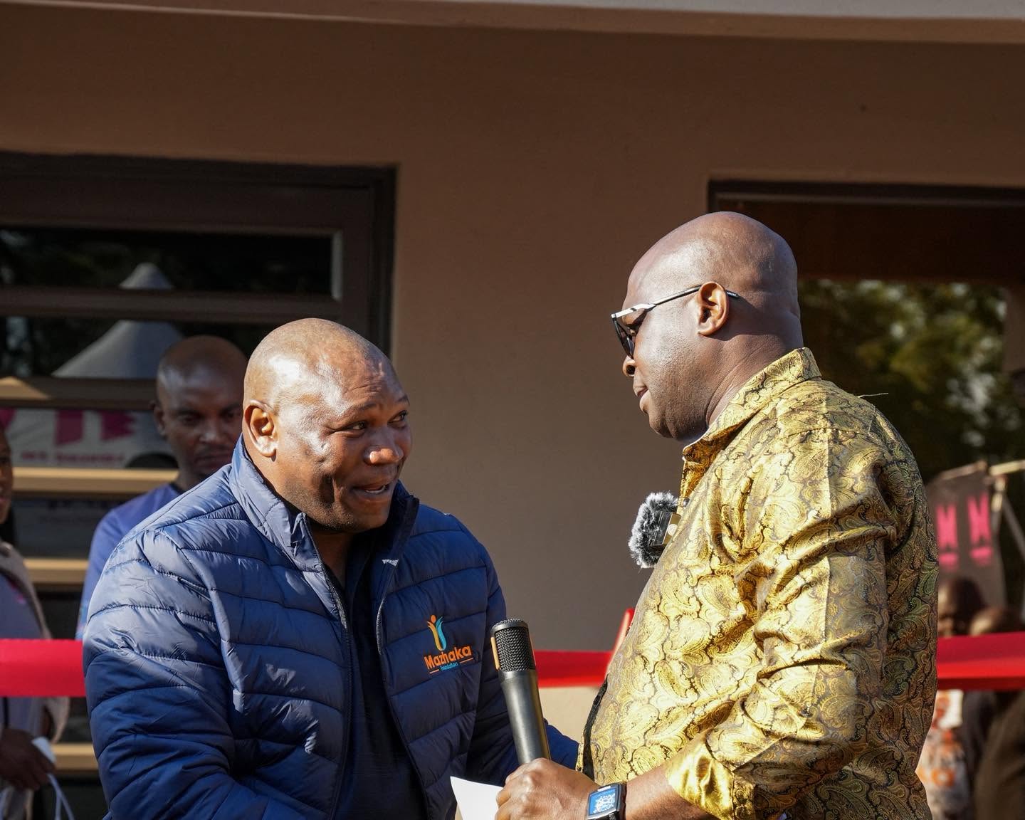 Officials share a conversation at the event